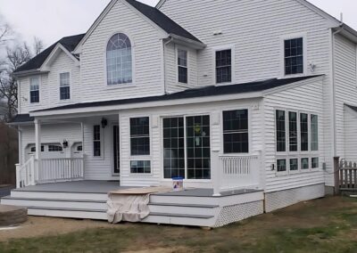 Completed sunroom and deck addition built by Lagace Construction to expand outdoor living space
